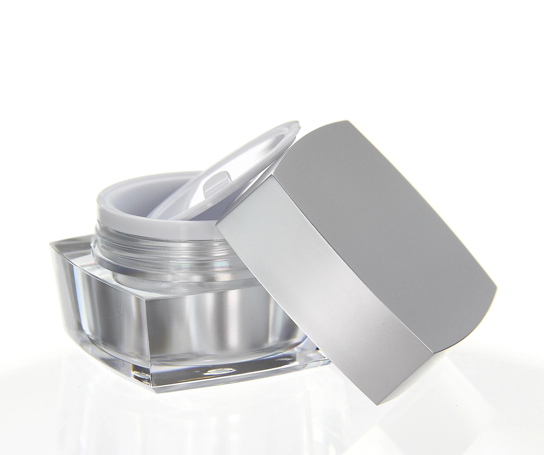 Open 30ml acrylic jar in glossy silver with white inner seal and clear base on light background