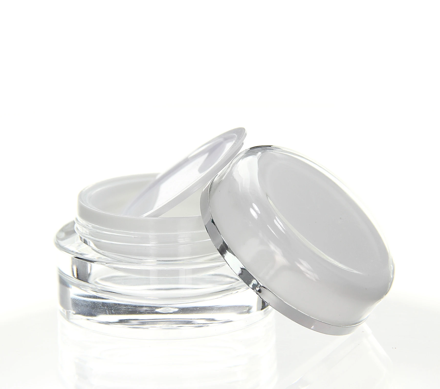 Open 15ml acrylic jar with white inner container, silver-edged cap and inner lid on white background