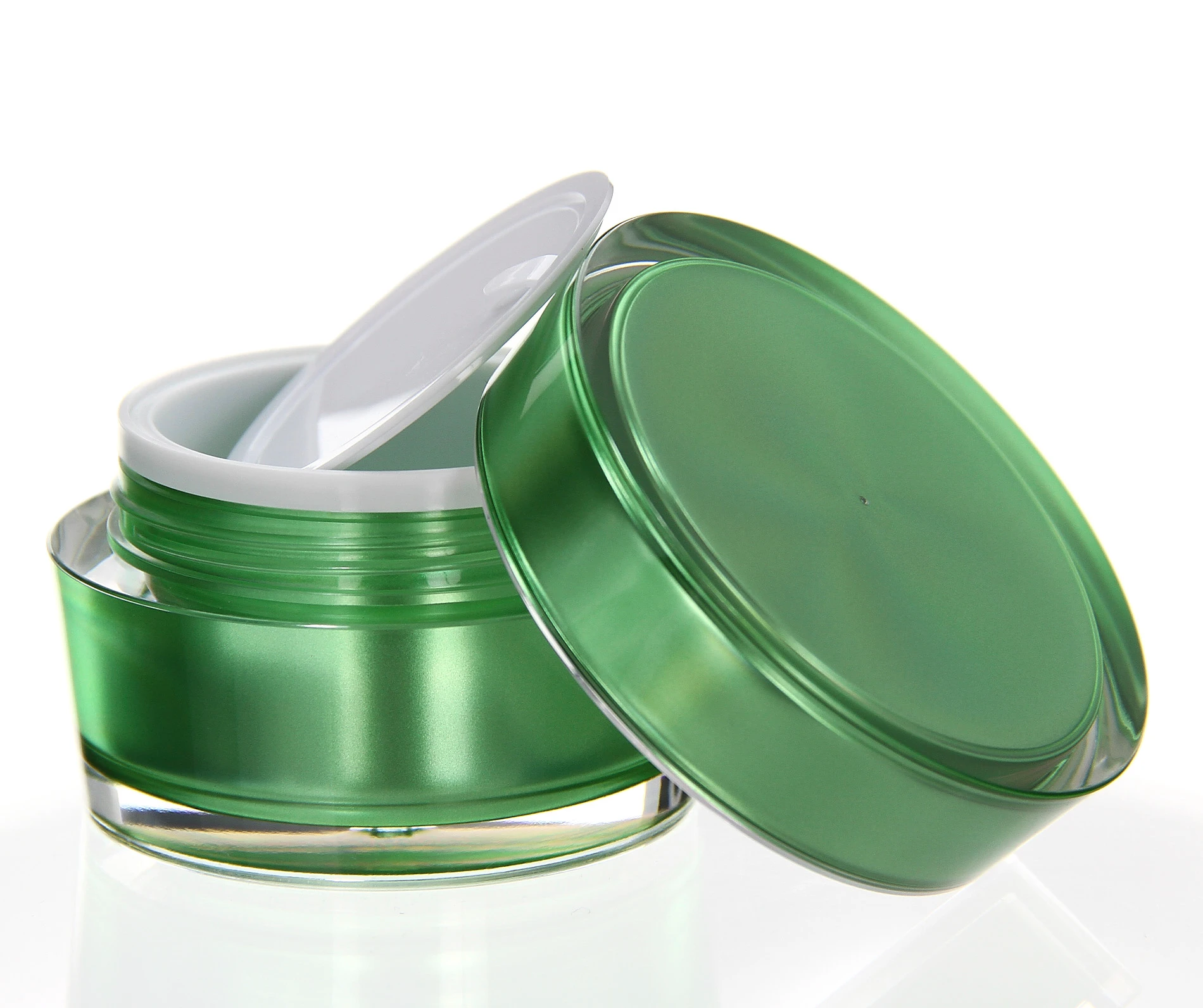 Glossy 50ml green acrylic jar with open lid and white sealing insert on light background