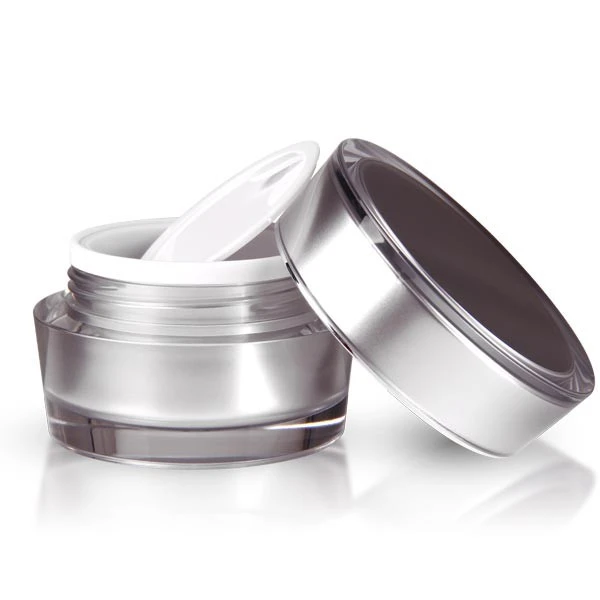 Opened 30ml acrylic jar in glossy silver with sealing disc on white background
