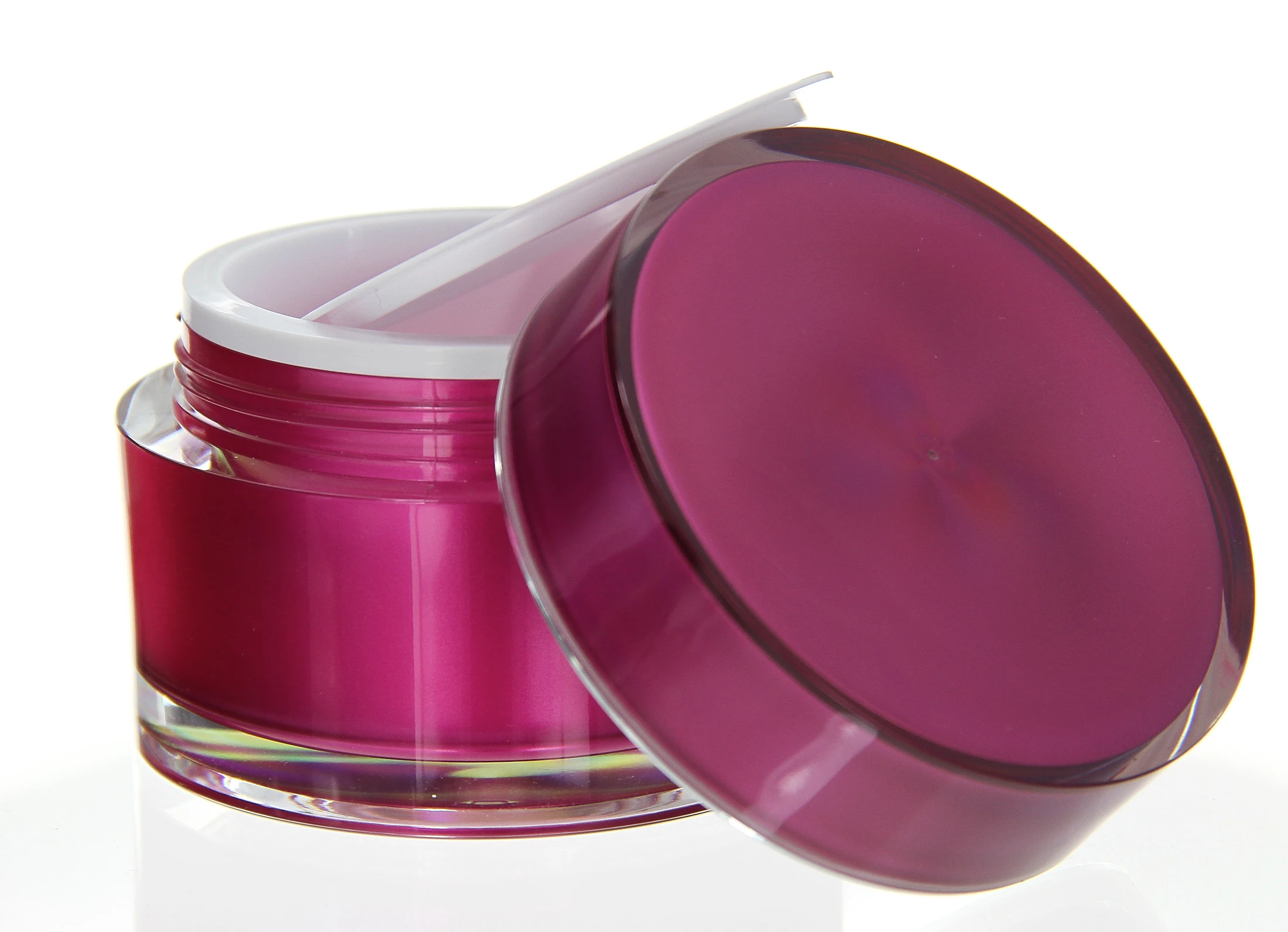 Open 100ml acrylic jar in glossy pink with white sealing insert on light pedestal