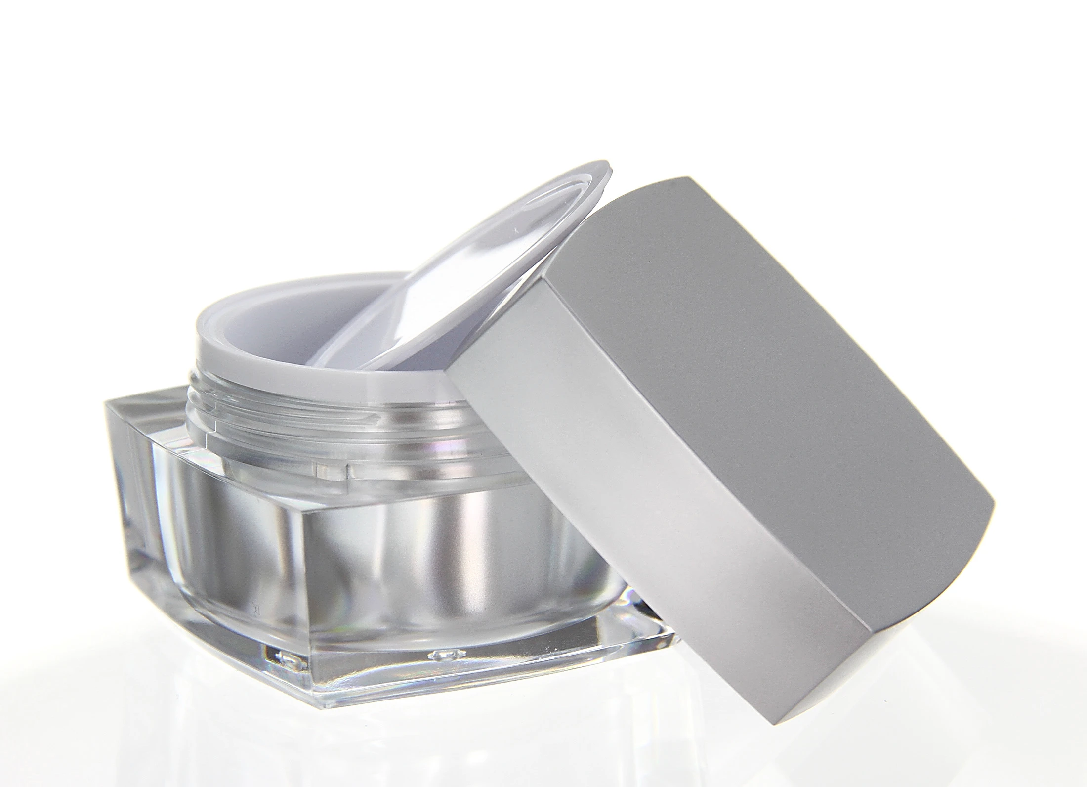 Open 50ml acrylic jar in glossy silver with white inner seal and clear base on light background