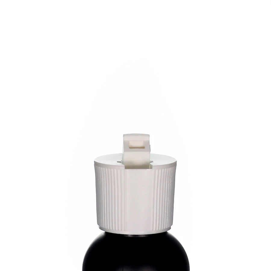 White polypropylene flip-top cap with open spout and ribbed surface on black bottle against light background