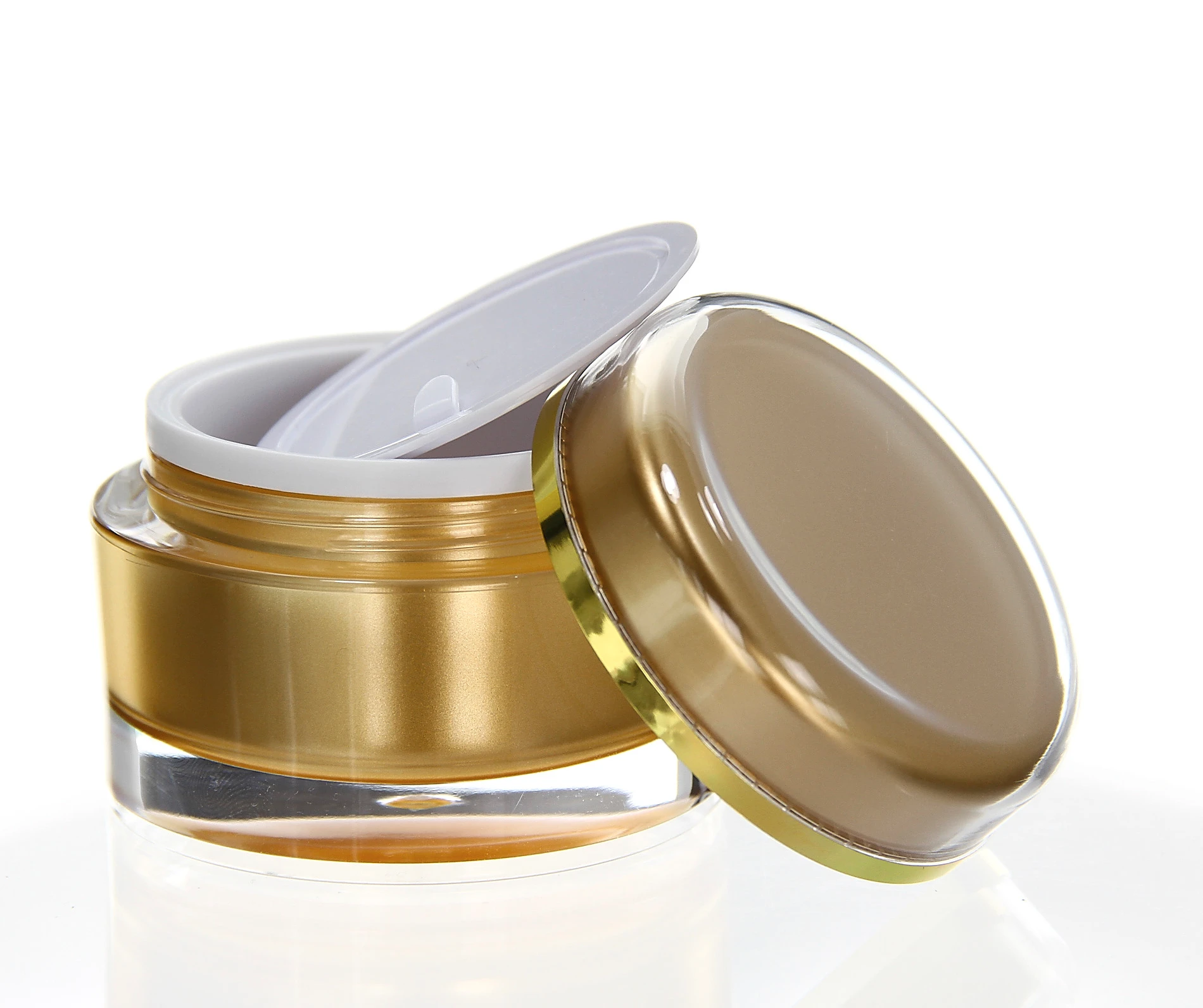 Open 50ml acrylic jar in glossy gold with white inner lid and golden cap on light background