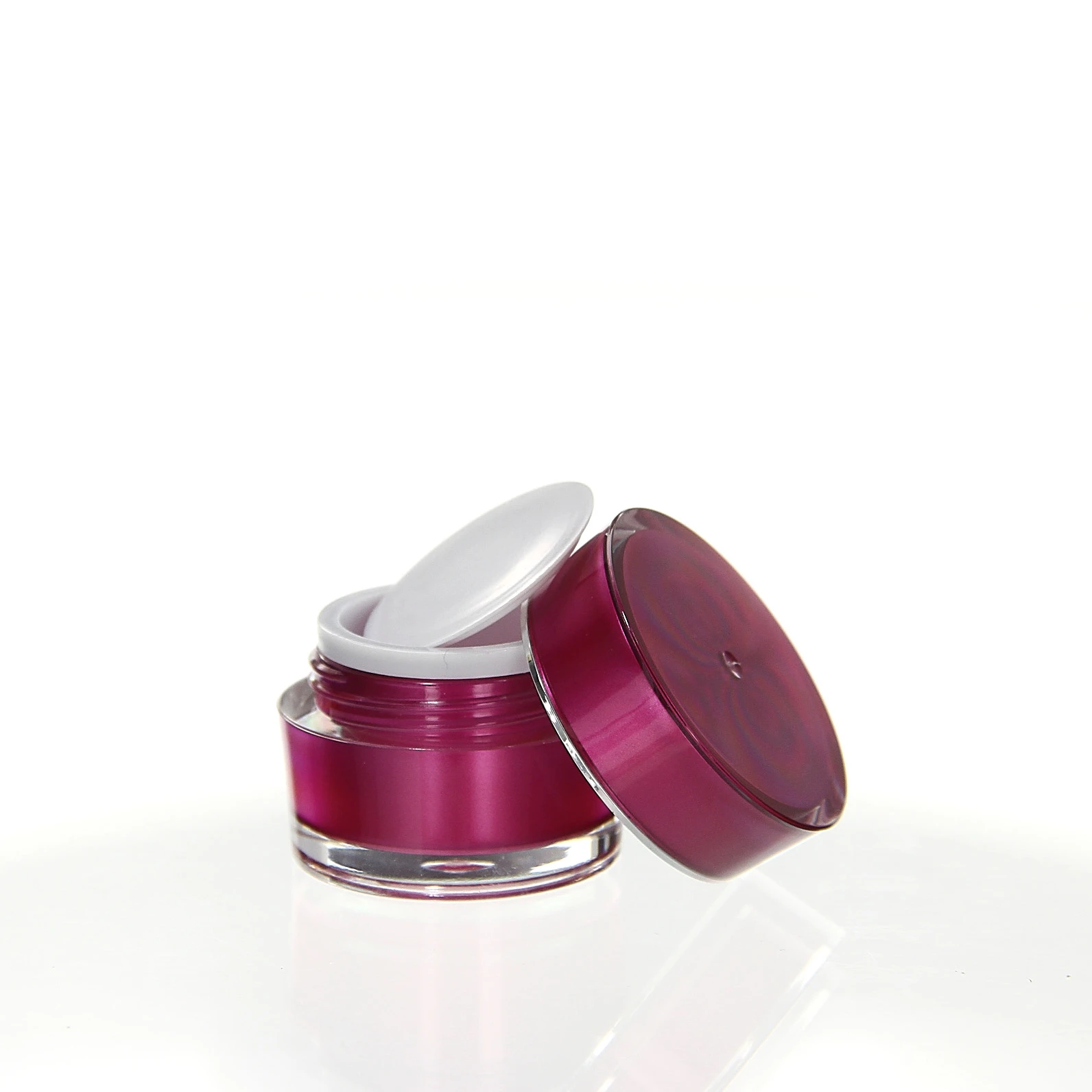 Open 5ml acrylic jar in pink with white sealing insert on glossy pedestal