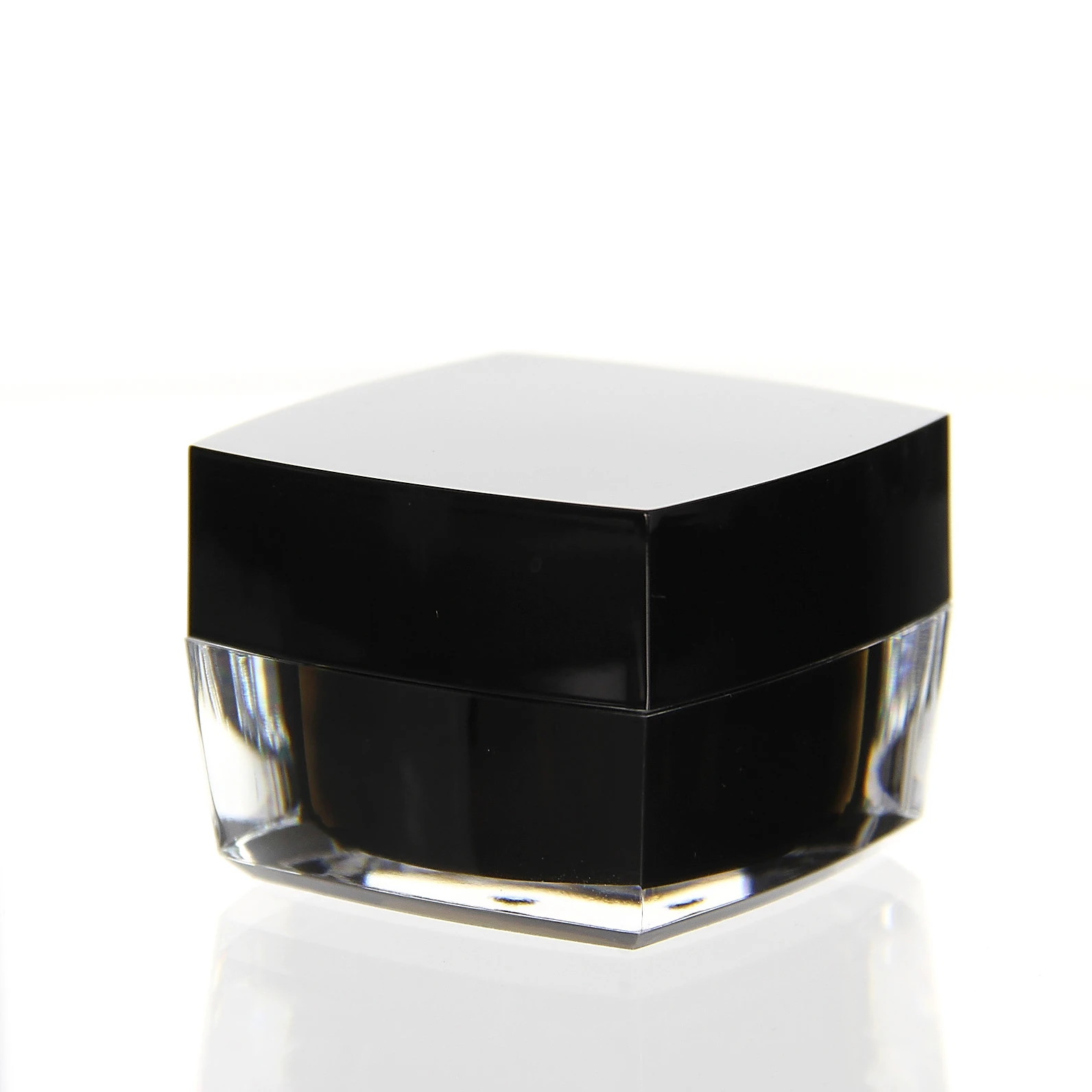Closed 30ml acrylic jar in glossy black with clear base on light background