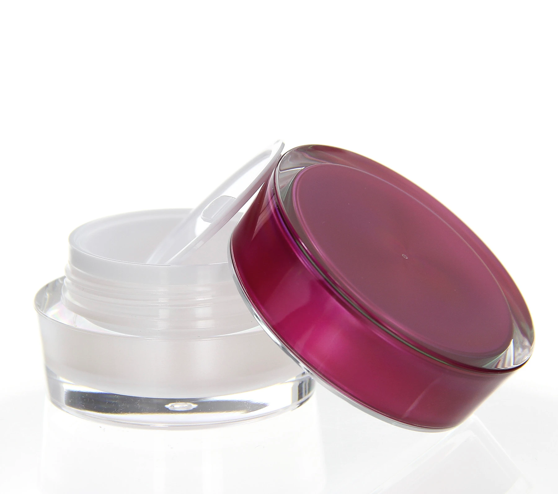 Open 15ml acrylic jar with pink lid and pearly white inner container on white pedestal