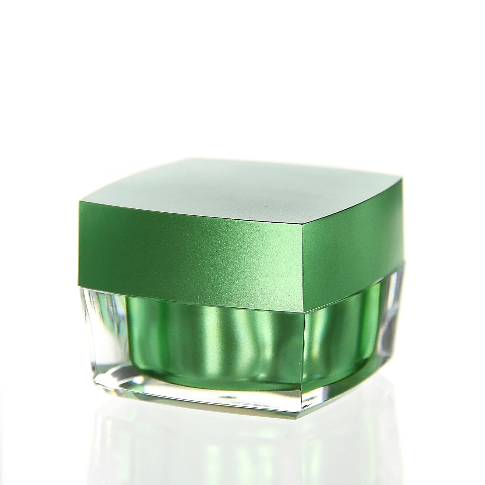 Closed 30ml cosmetic jar in glossy green with clear acrylic outer shell on white background