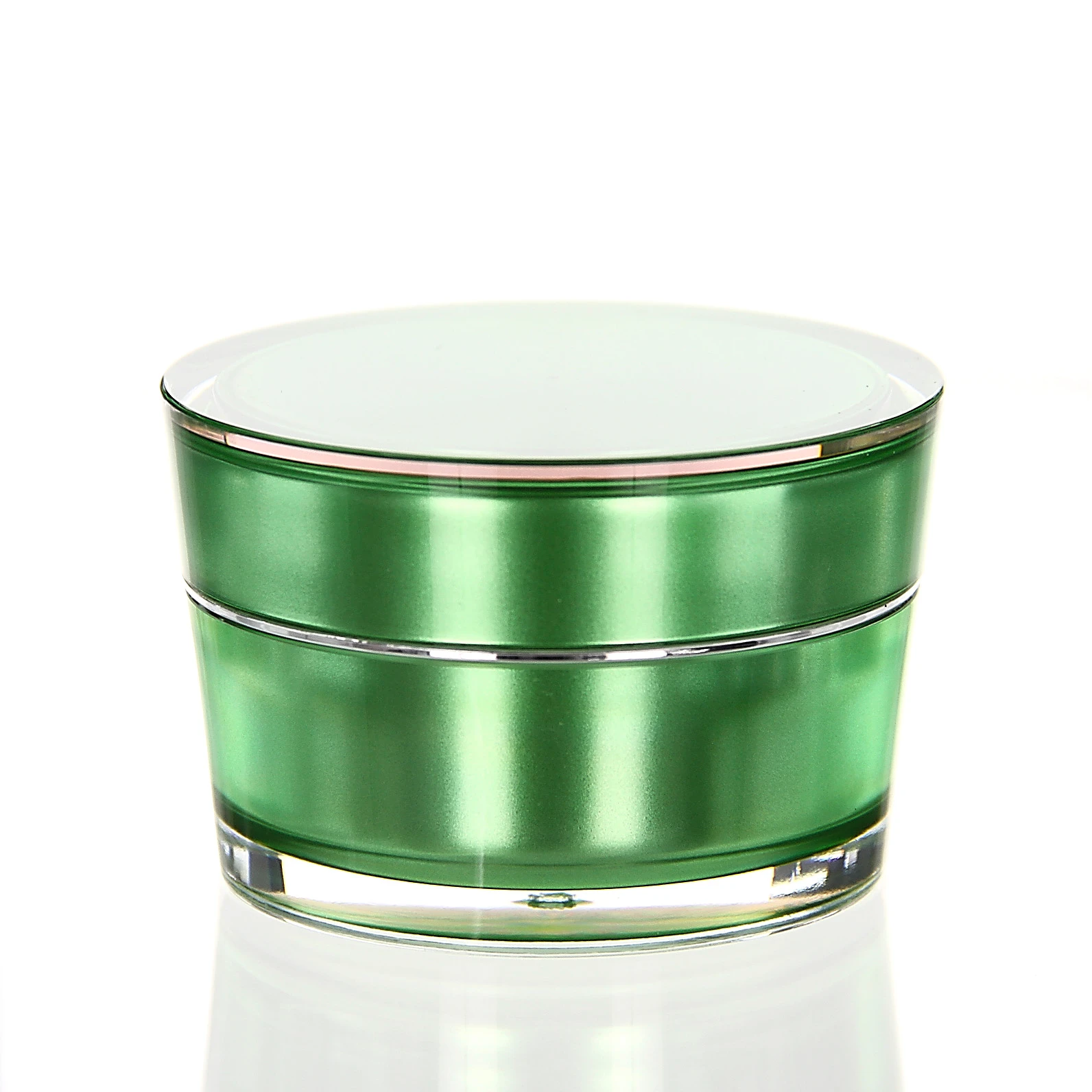 Closed 50ml acrylic jar in glossy green with transparent outer shell on white pedestal