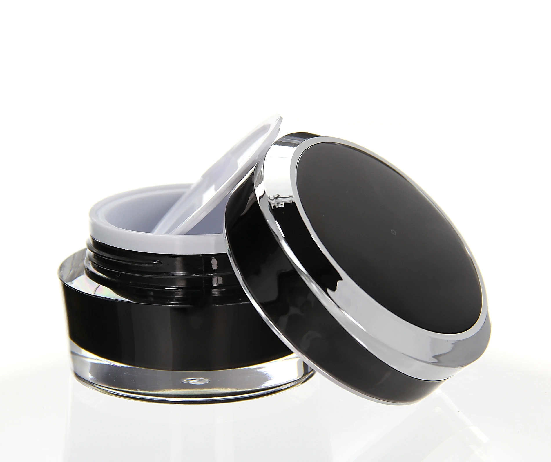 Open 30ml Mars acrylic jar in black with glossy lid and white inner disc on bright background
