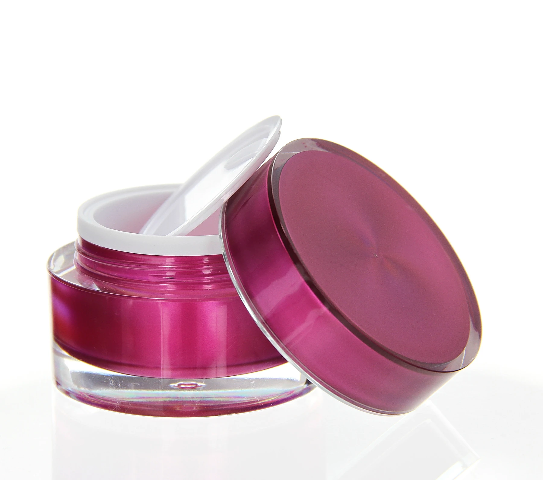 Opened 30ml pink acrylic jar with sealing disc and glossy finish on white background