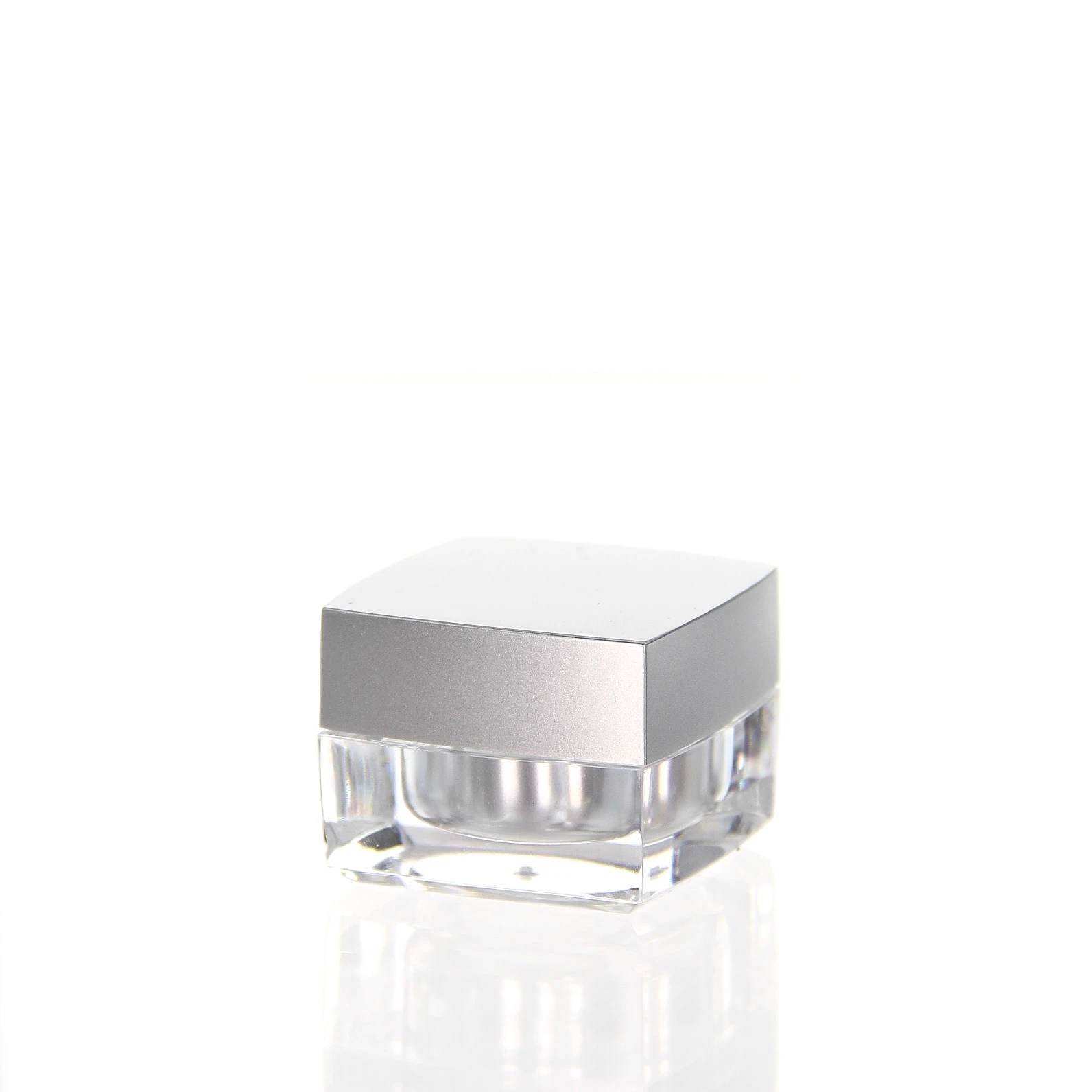 Closed 5ml acrylic jar in glossy silver with square shape on light background