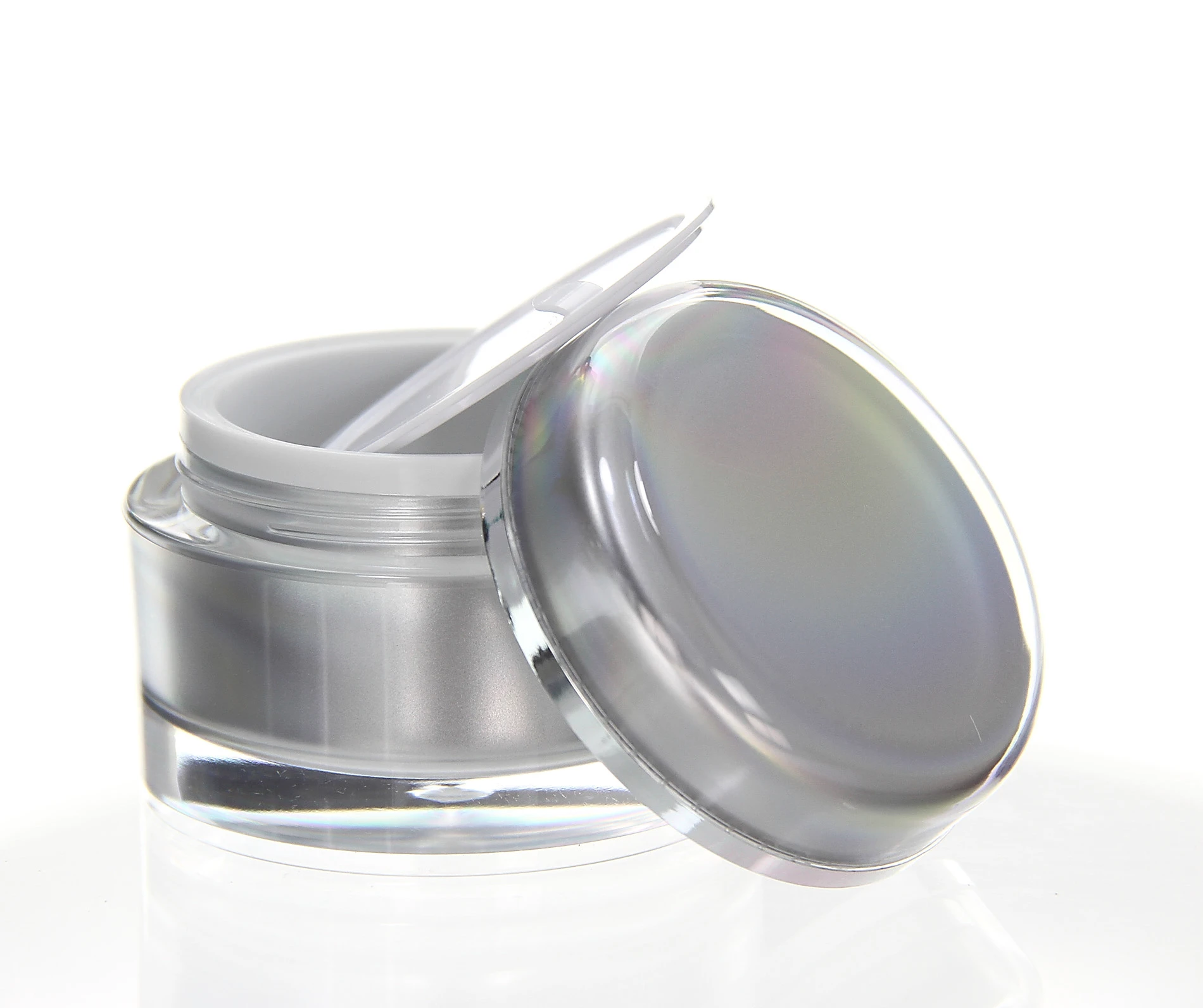 Open 50ml acrylic jar in glossy silver with white inner lid and tilted cap on white background