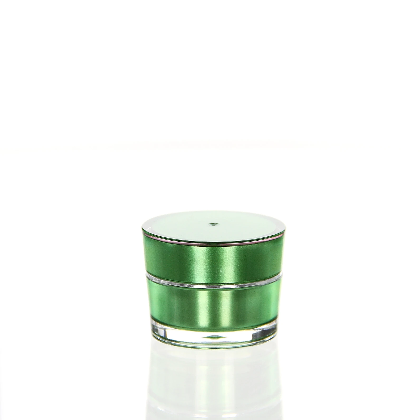 Closed 5ml acrylic jar in glossy green with transparent outer wall on white pedestal